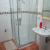 Cuarto de Baño, equipado con cabina ducha, taza y lavabo, estantería, alfombra, toallas (se cambian periodicamente a petición del cliente), jabón gel, agua sanitaria con termo eléctrico de 100 litros.